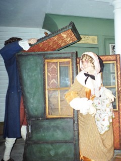 lady getting out of sedan chair